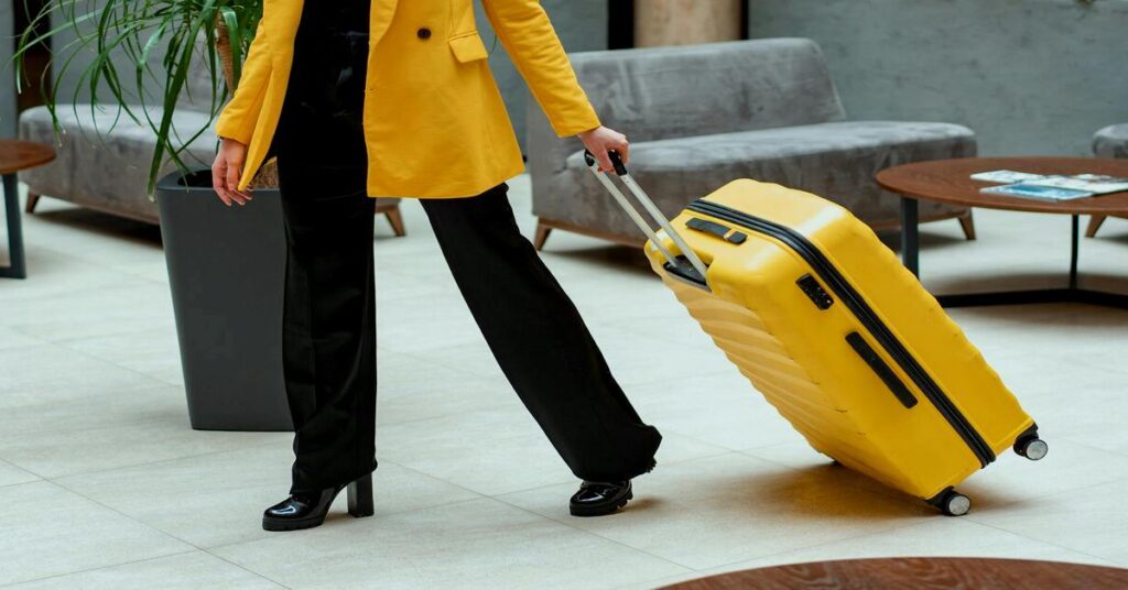 How to Choose Safe Accommodation as a solo female traveler checking into a secure hotel lobby