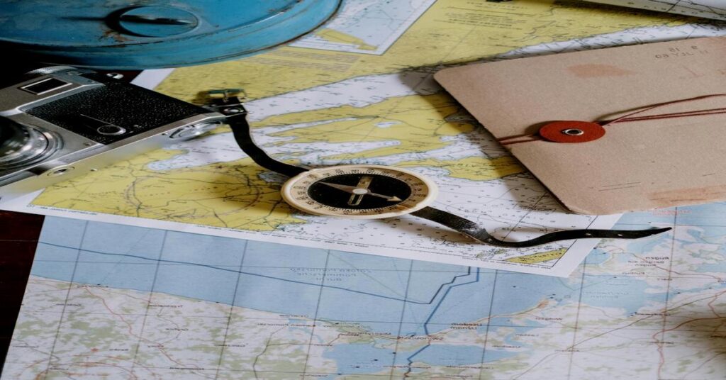 15 Smart Solo Travel Budget Tips to Save Money & Pack Light 5 scenic landscape winding road notebook camera travel plan