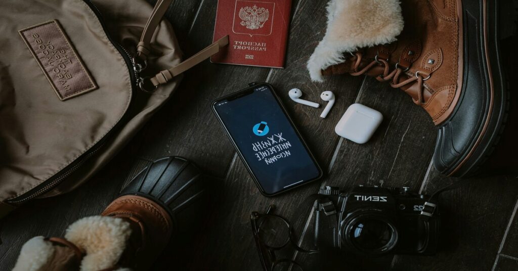 Digital minimalism for solo travelers showcased through a clean flatlay of a backpack, passport, and one smartphone