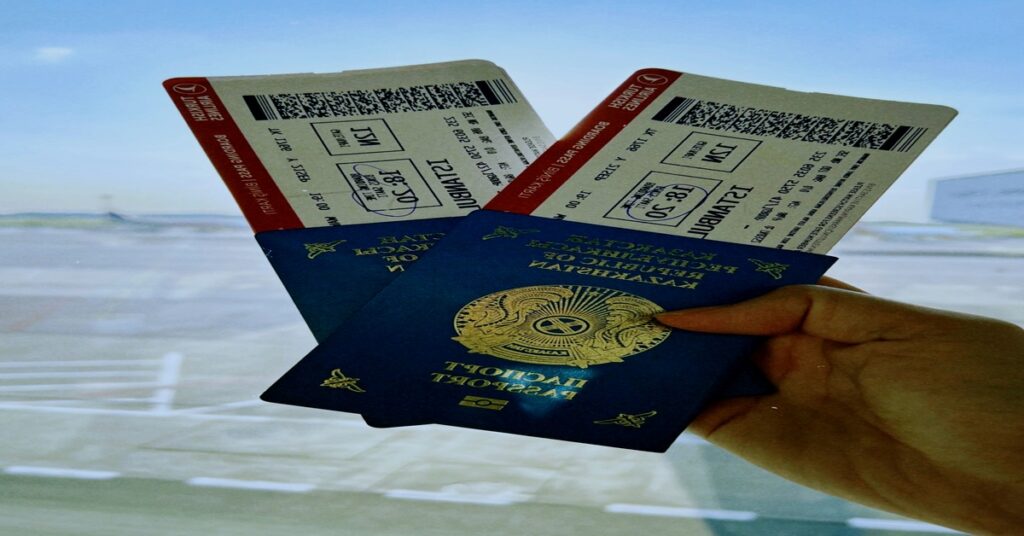 Solo travel tips for students featured image showcasing a passport, boarding pass, and luggage at an airport gate