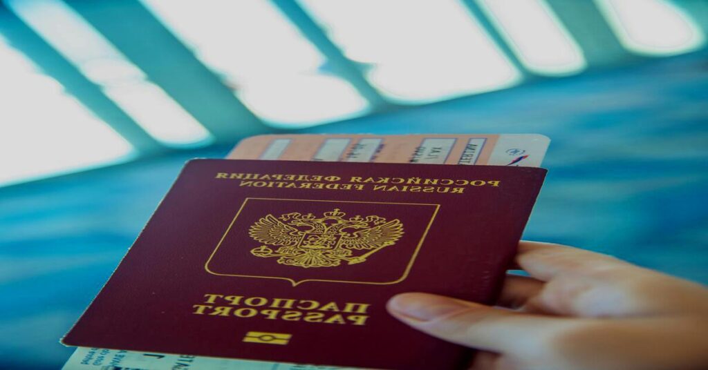 Solo travel tips for women checklist being reviewed by a traveler holding a passport at an airport gate