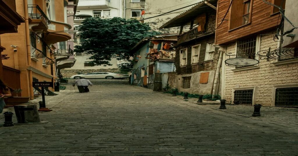 Solo Travel Tips for Women: 15 Safe Ways to Explore Alone 5 woman walking back view cobblestone street safe neighborhood architecture