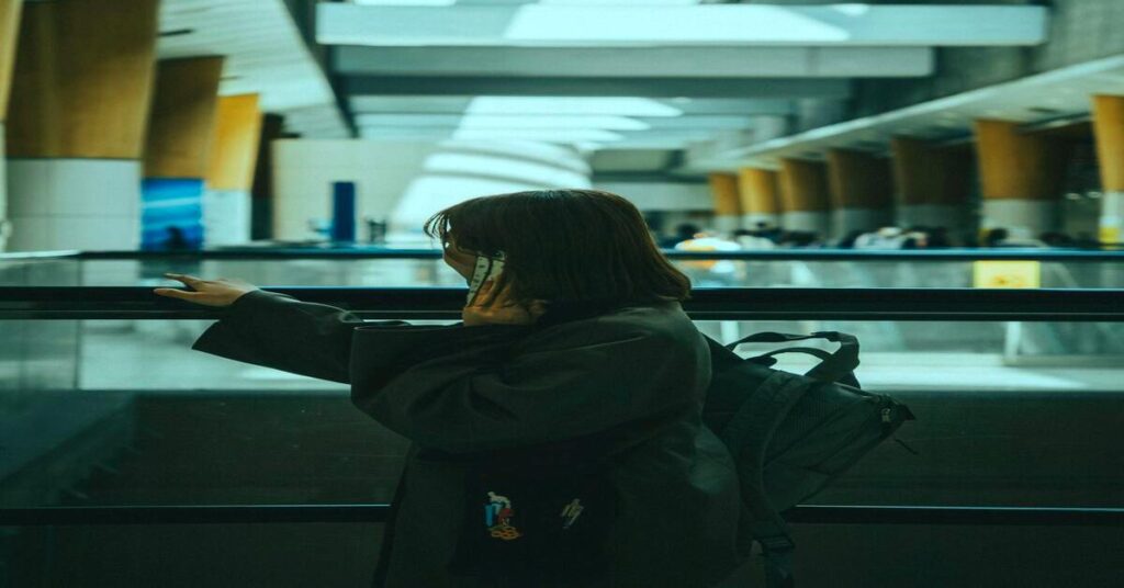 Solo travel apps you must use displayed on phone by traveler at airport