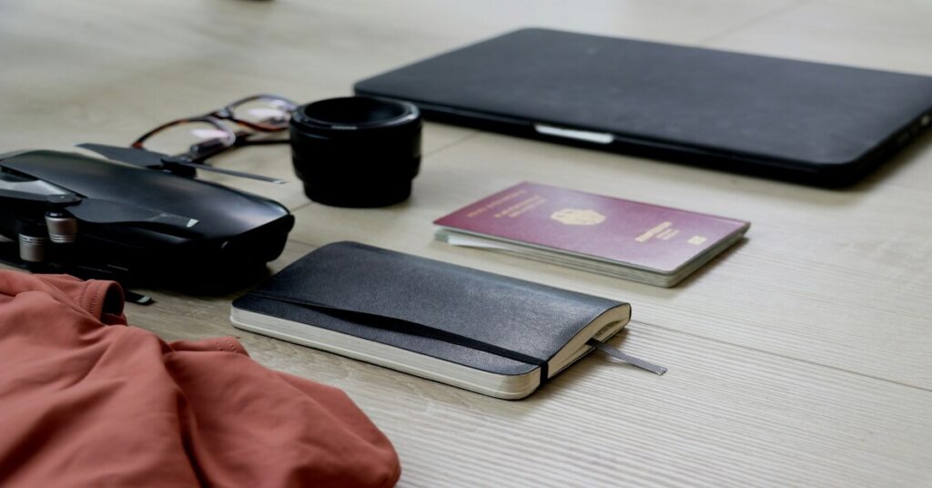 Flatlay of travel security gear premium anti theft backpack rfid wallet passport