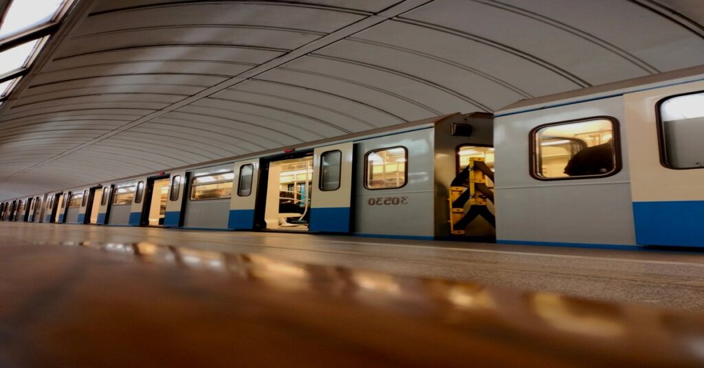 Reverse Solo Touring: Outsmart Crowds & Explore US Quietly 5 Reverse solo touring approach shown through an empty modern train platform during quiet, off-peak afternoon transit hours