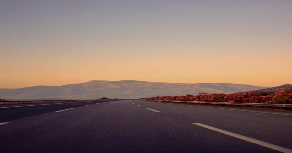 Scenic empty highway road trip mountains horizon