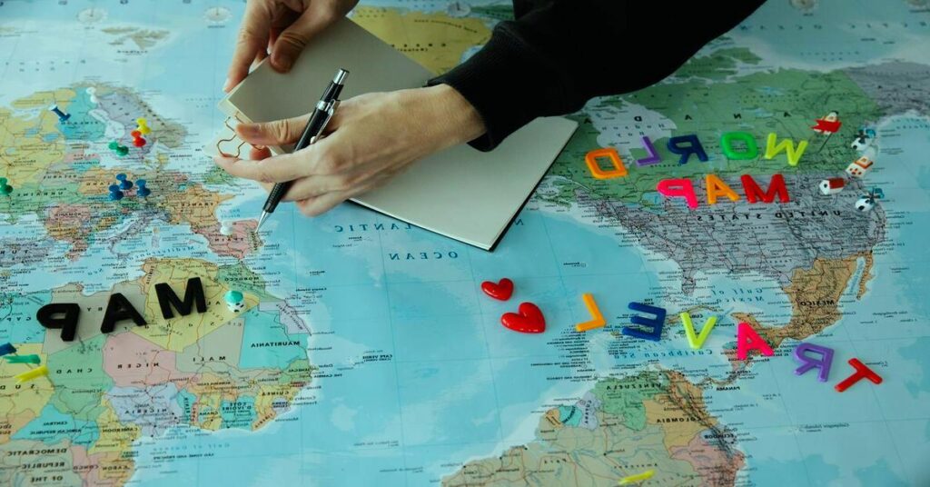 world map planning travel notebook coffee