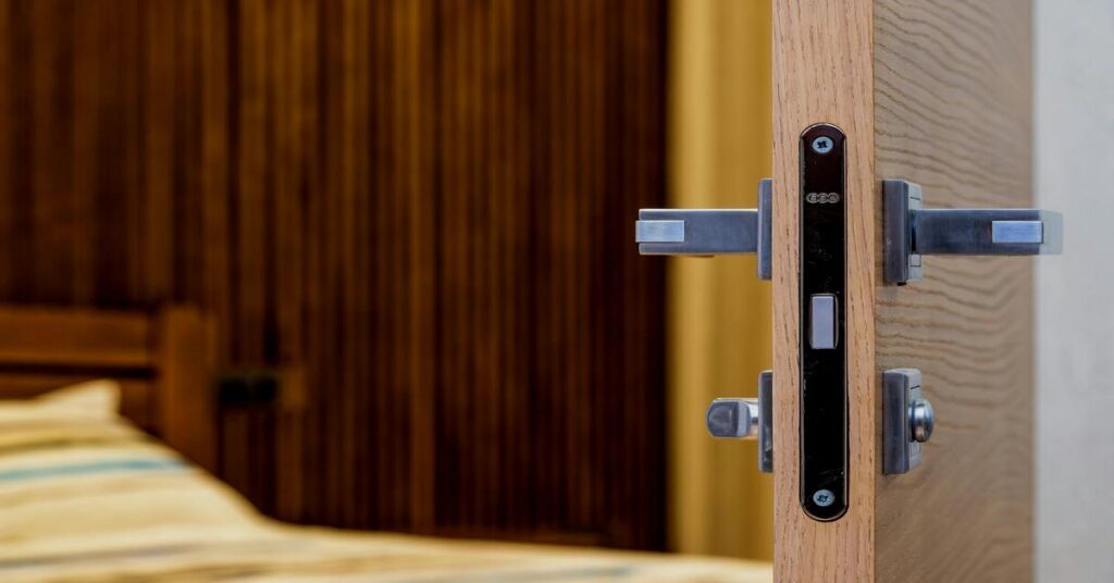 Close up hotel door heavy duty metal handle lock security privacy