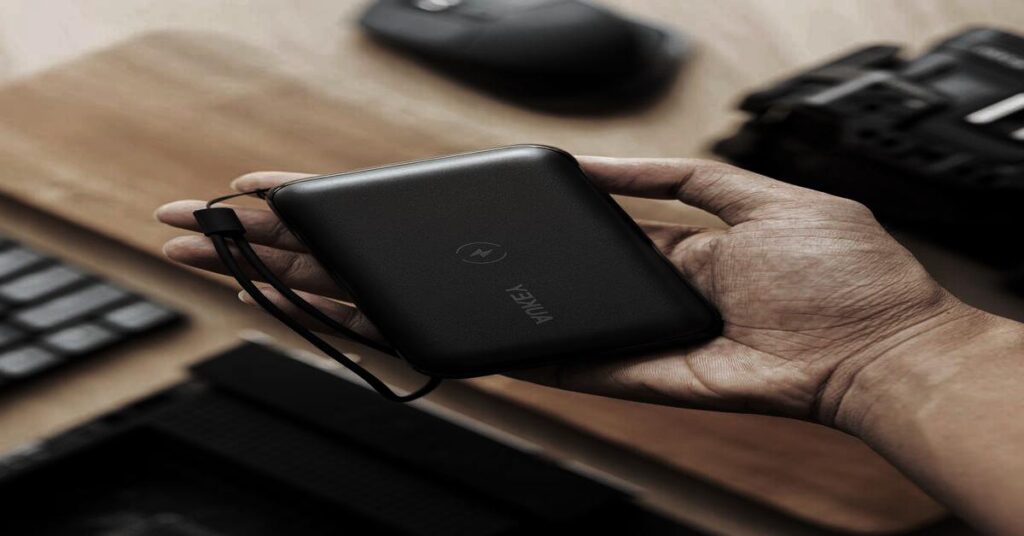 7 Best Power Bank Essentials for Travel for Flights and Road Trips 5 Power Bank Essentials for Travel showing traveler using power bank at airport