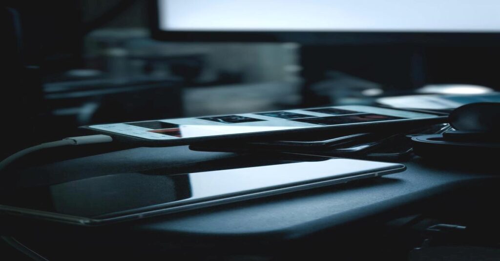 person charging phone hotel room travel adapter usage lifestyle travel electronics