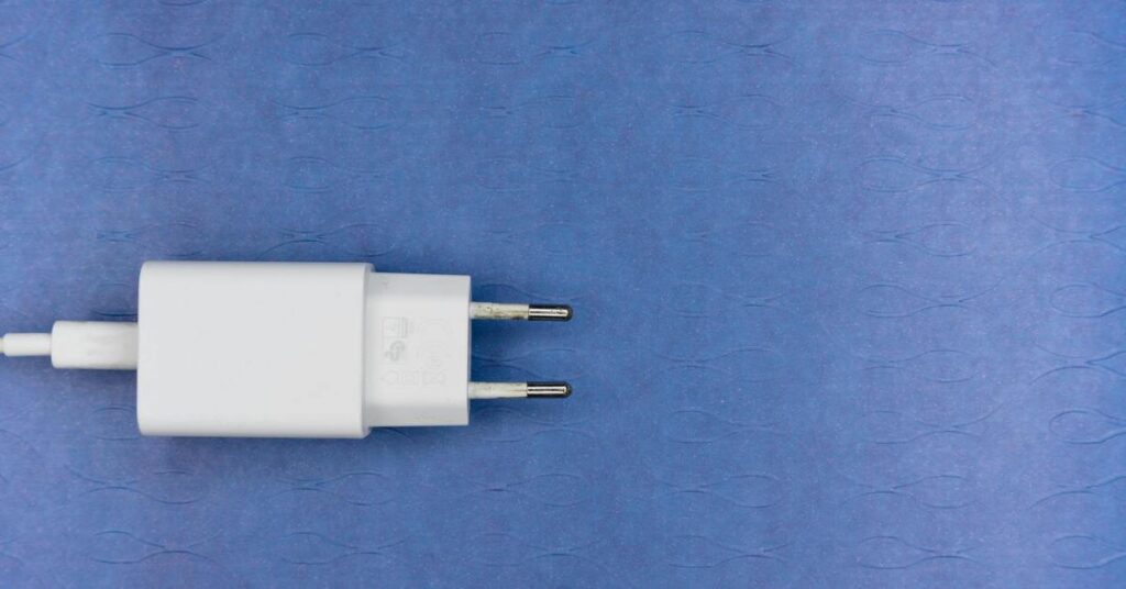 small white wall charger block electronic close up