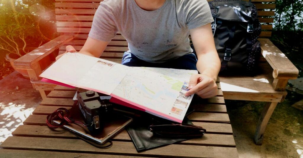 How to Make Friends While Traveling Alone by sitting approachably at a local cafe table
