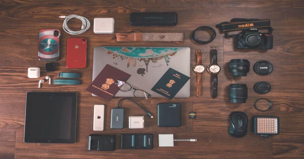 International Travel Plug Adapter Guide featuring global travel essentials and multi-nation power adapters arranged neatly on a table