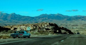 🌍 SOLO TRAVEL GUIDE 9 Best Solo Road Trips in the USA scenic highway view with solo traveler car