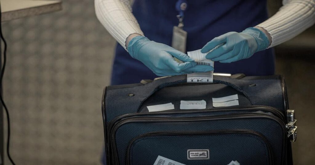 airport baggage fee payment traveler stress counter