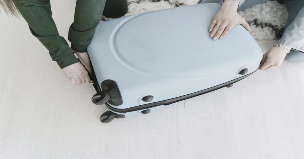 airport suitcase weighing scale close up travel packing