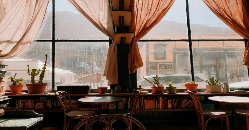 cozy aesthetic coffee shop window seat book cafe