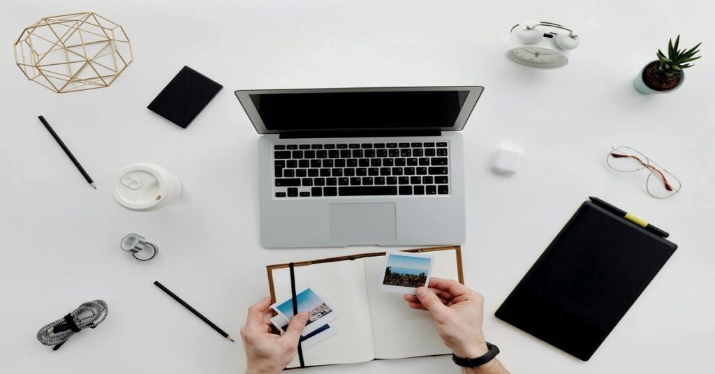 digital nomad workspace minimal flatlay laptop desk organization