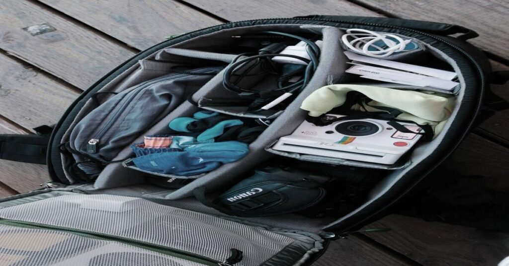 organized travel backpack electronics pouch compartments