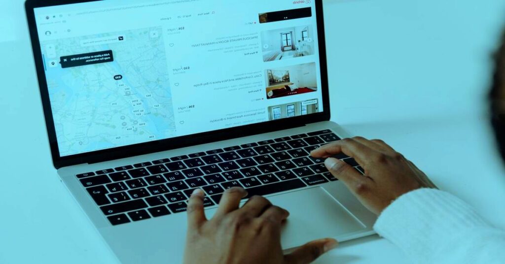 person searching cheap flights laptop night travel planning