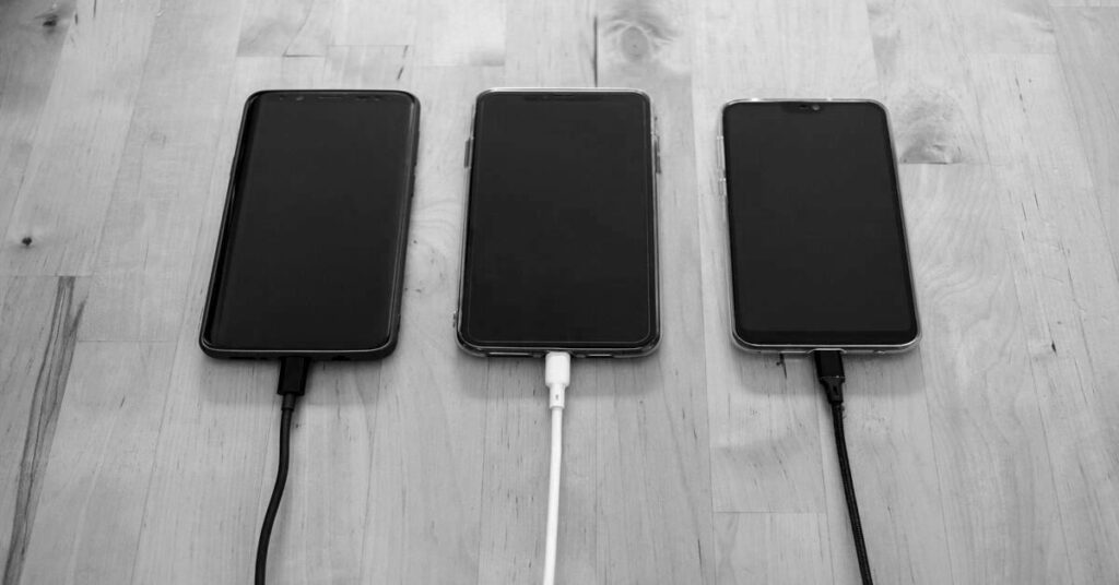 travel charging setup organized in suitcase with cables adapter and power bank for stress free travel packing