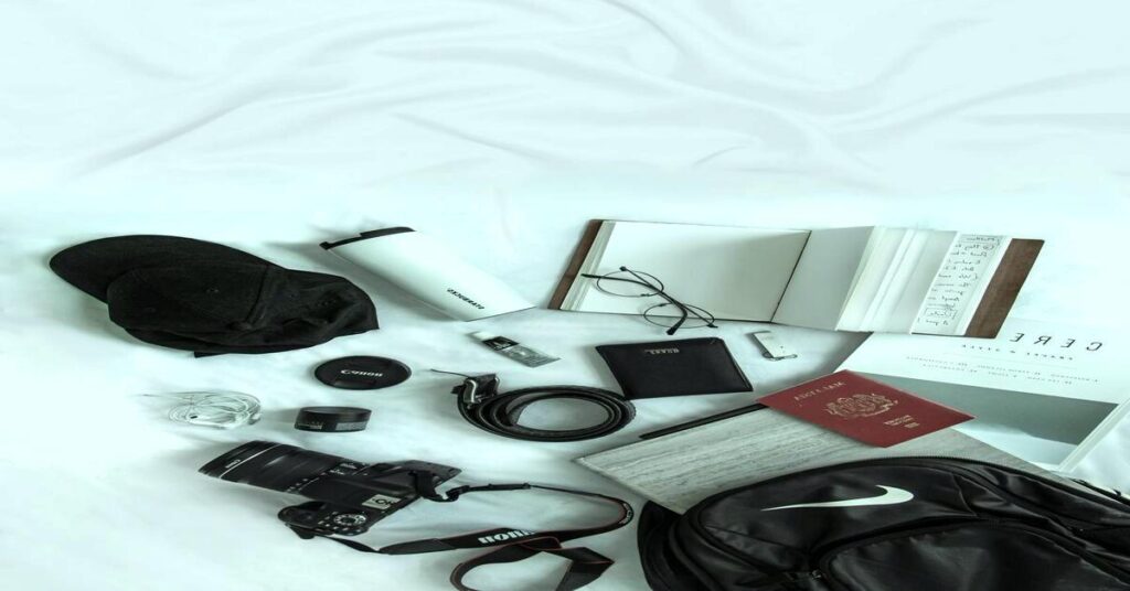 travel gear essentials backpack neck pillow passport wallet