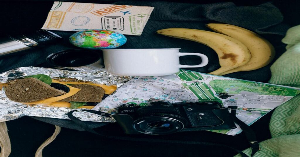 Beginner solo travel tips for first-time adventurers packing a neat flatlay setup with map and passport