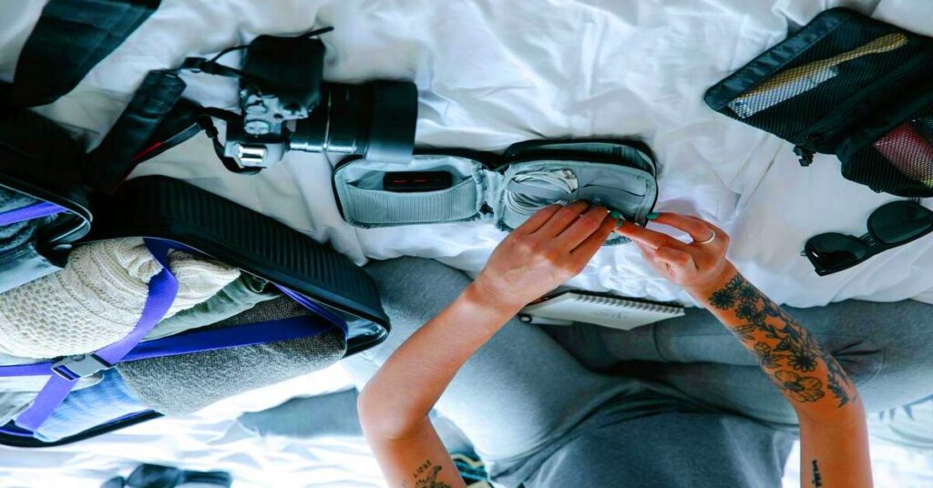 traveler unpacking tech pouch electronics laptop charger