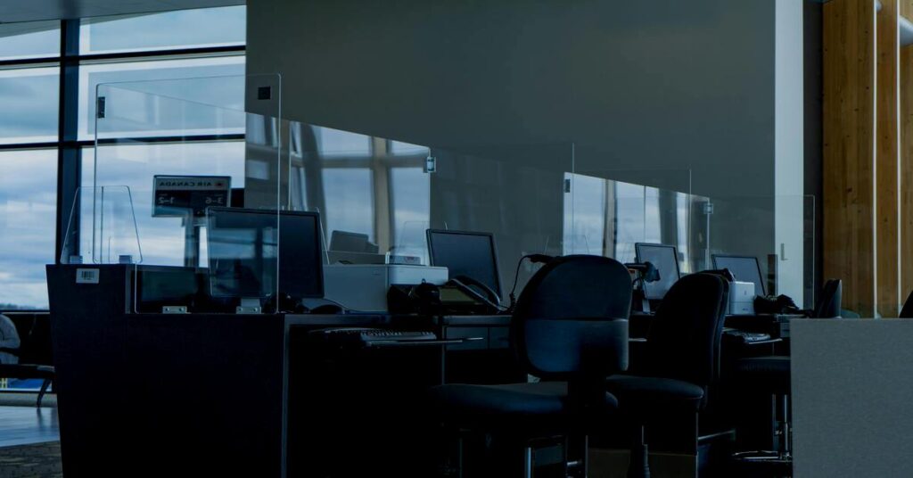 Bright safety security help desk counter inside busy international airport terminal with friendly professional staff