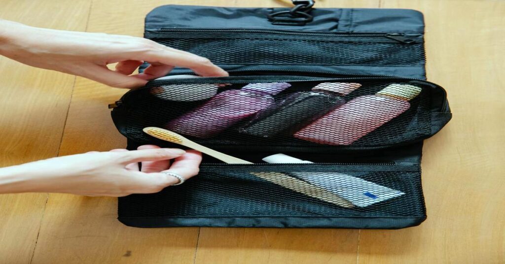 Best travel toiletry bag leak-proof feature banner showcasing organized cosmetics and skincare bottles inside a suitcase