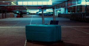 TSA-Approved Luggage Locks for Safe Travel on a premium hardshell suitcase at the airport terminal