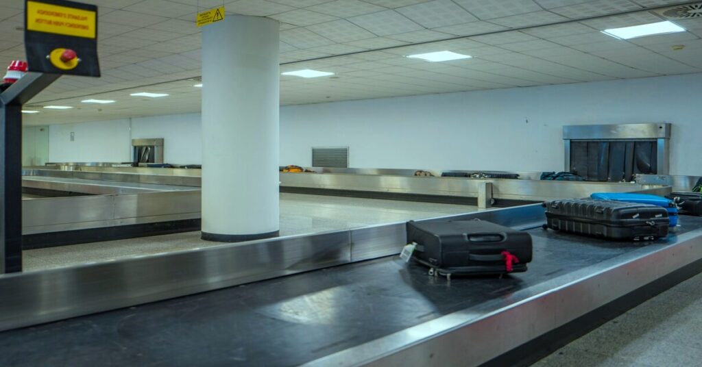 airport baggage carousel suitcase travel stress security