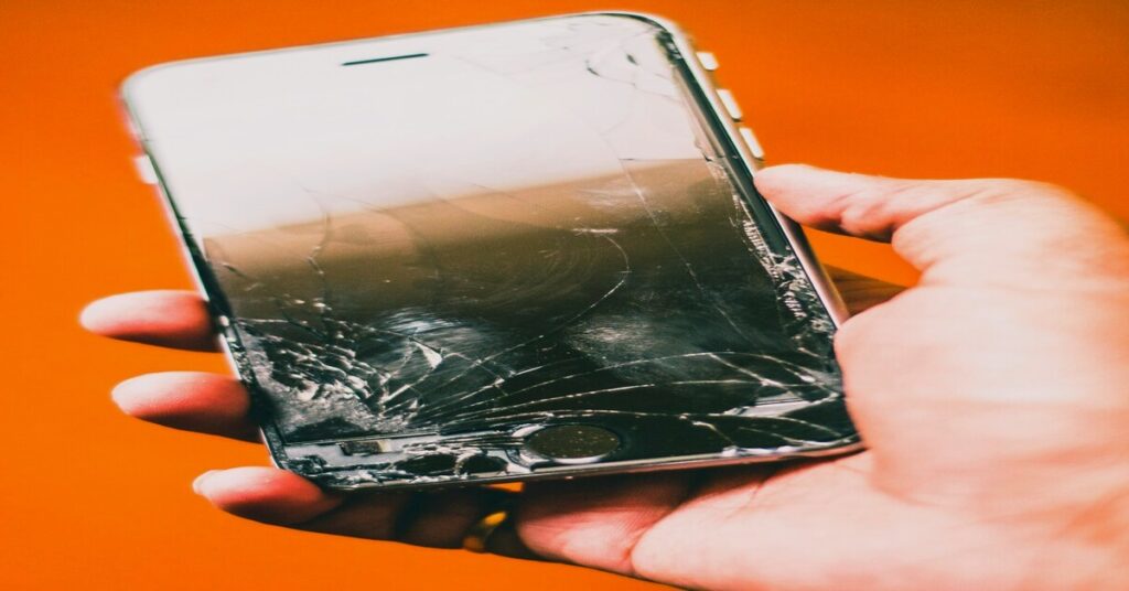 broken phone screen travel emergency stress hands