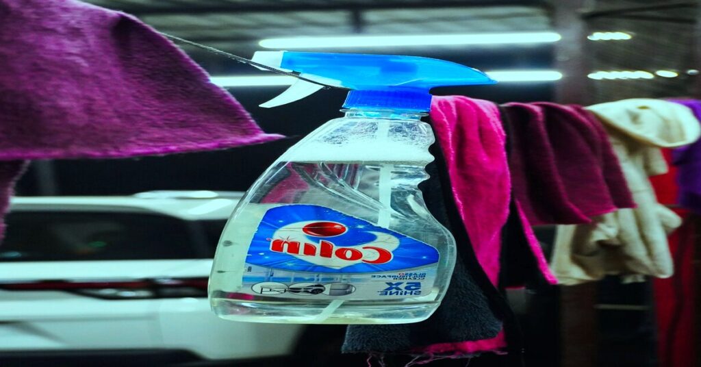 spray bottle and fabric clothes hanger along with minimal background