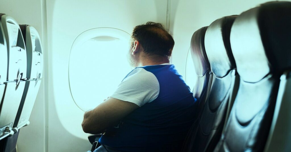tired traveler airplane neck pain sleep discomfort