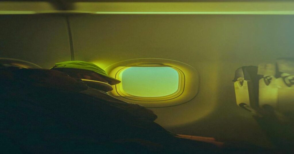 travel sleep setup dark airplane window seat night no face