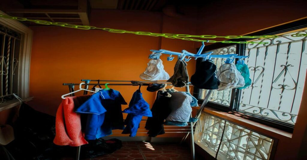 wet clothes hostel room travel drying line no people
