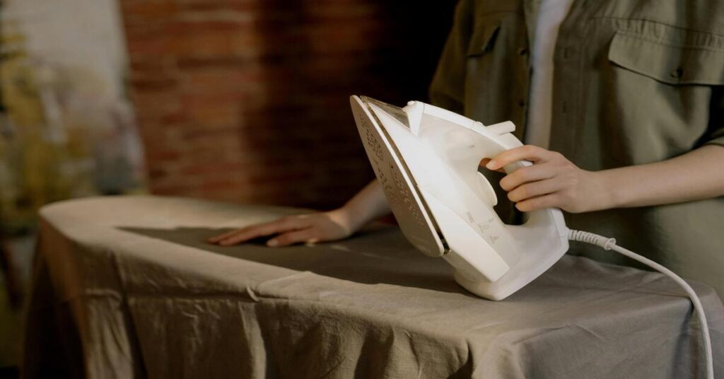 Best travel mini iron for hostel stays being used to remove tough wrinkles from light fabrics easily