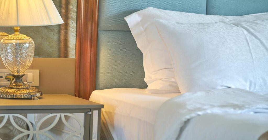 Hotel room bedside table nightstand close up