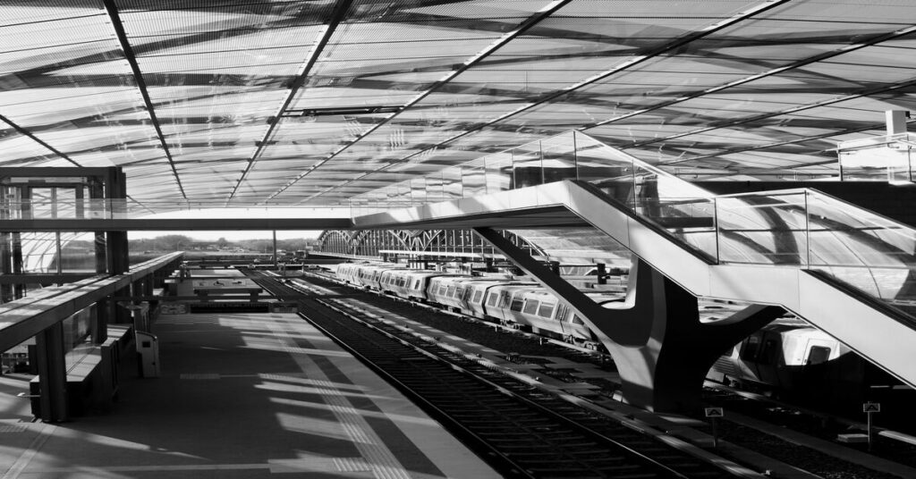 Best US Cities for Solo Travel Without a Car: Safe & Walkable 3 Modern commuter transit train station architecture platform elevated tracks