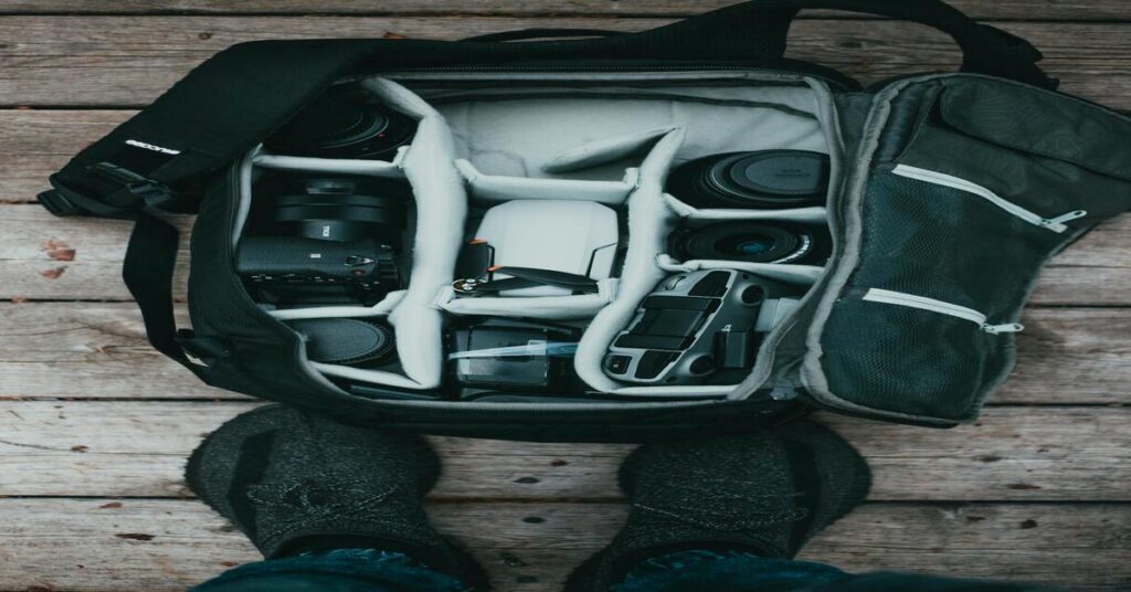 Open travel backpack with organized packing cubes inside