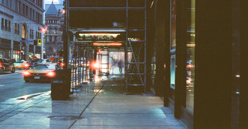 city street night lights sidewalk moody perspective