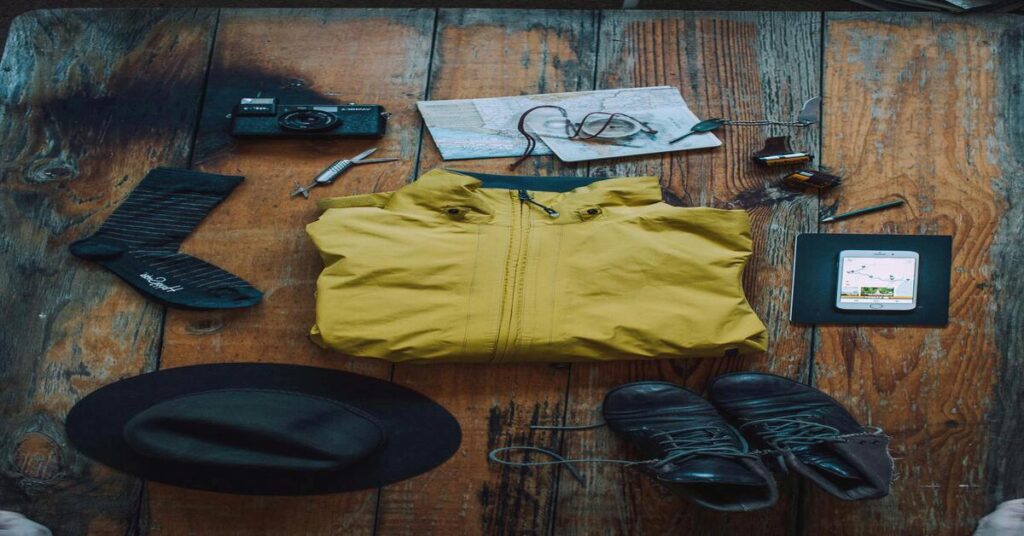 5 Best Solo Travel First Aid Kits (2026 Emergency Guide) 3 hiking gear flat lay equipment mapping