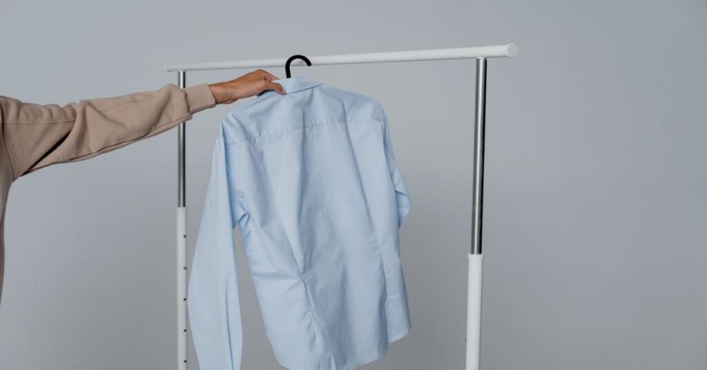 Best Portable Travel Clothes Steamer Dual Voltage: Top 3 Picks 3 steaming clothes shirt hanging on hanger